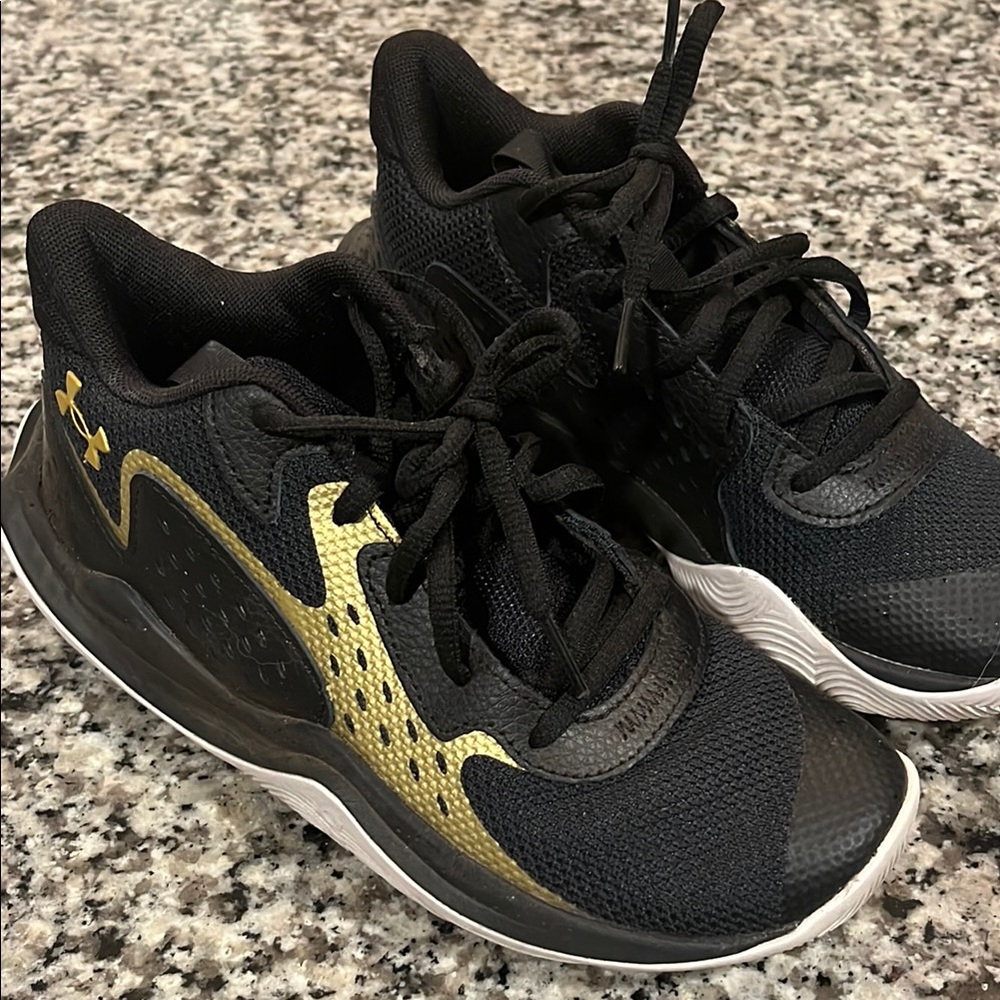 Under Armour Black and Gold Sneakers with Breathable Mesh and Cushioned Heel